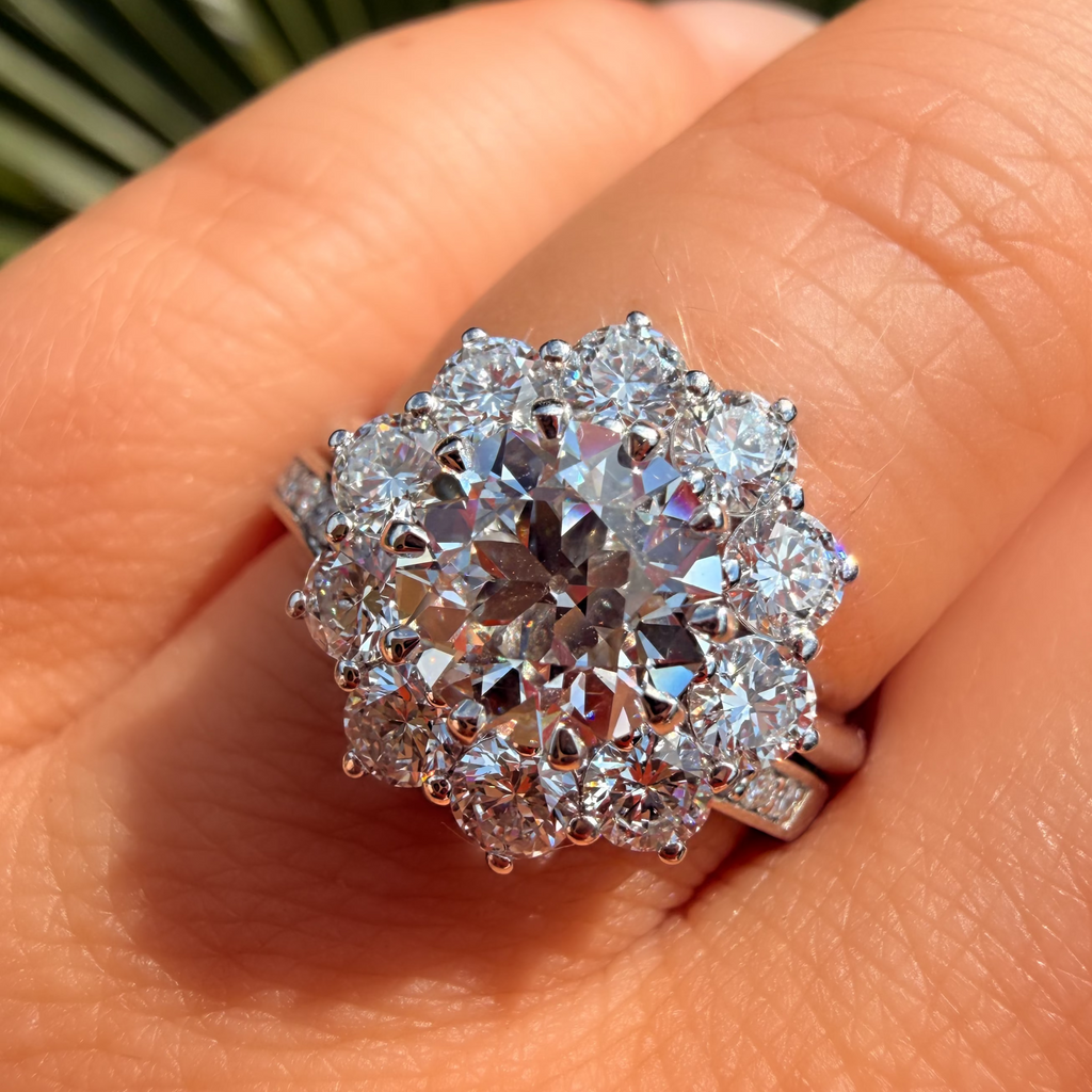 Diamond ring on a person's finger with a blurred natural background