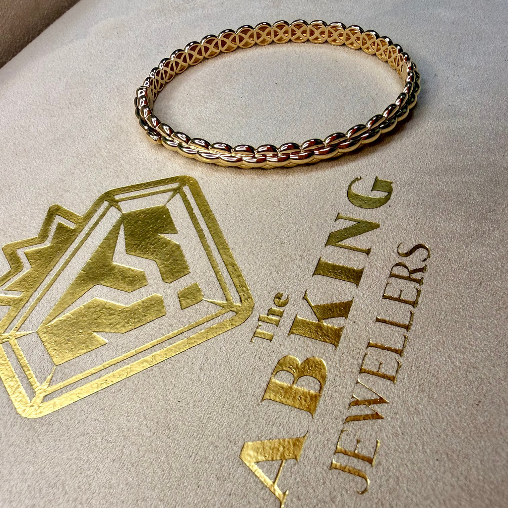 Gold bracelet on a branded jewelry box with 'Lab King Jewellers' logo.