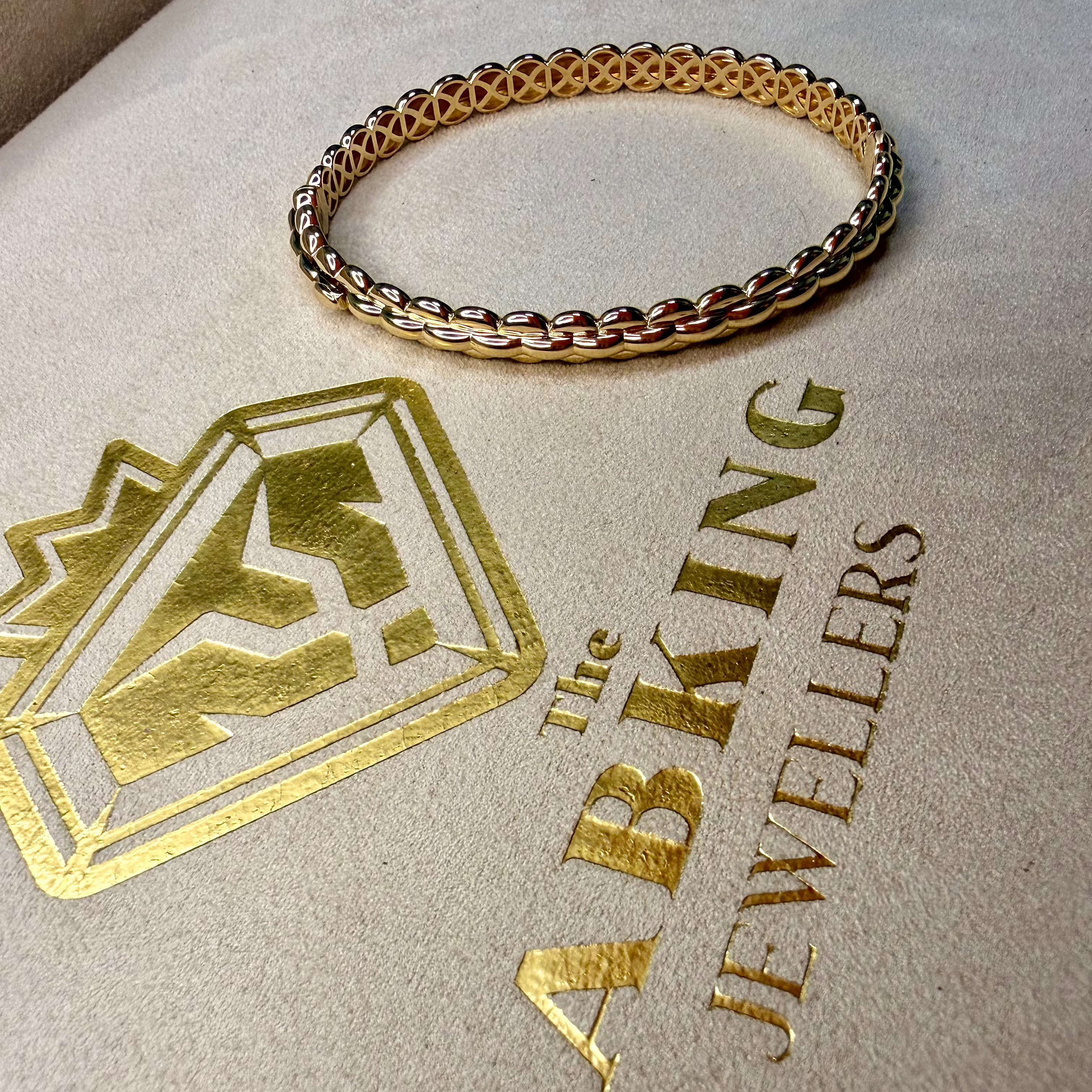 Gold bracelet on a branded jewelry box with 'Lab King Jewellers' logo.