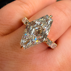 Diamond ring on a hand with a blurred background