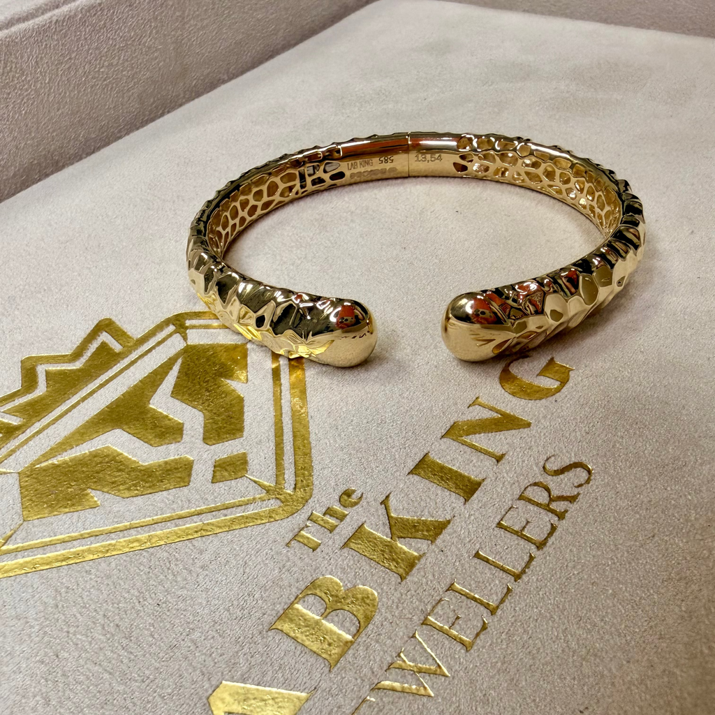 Gold bracelet on a branded jewelry box with 'Lab King Jewellers' logo.
