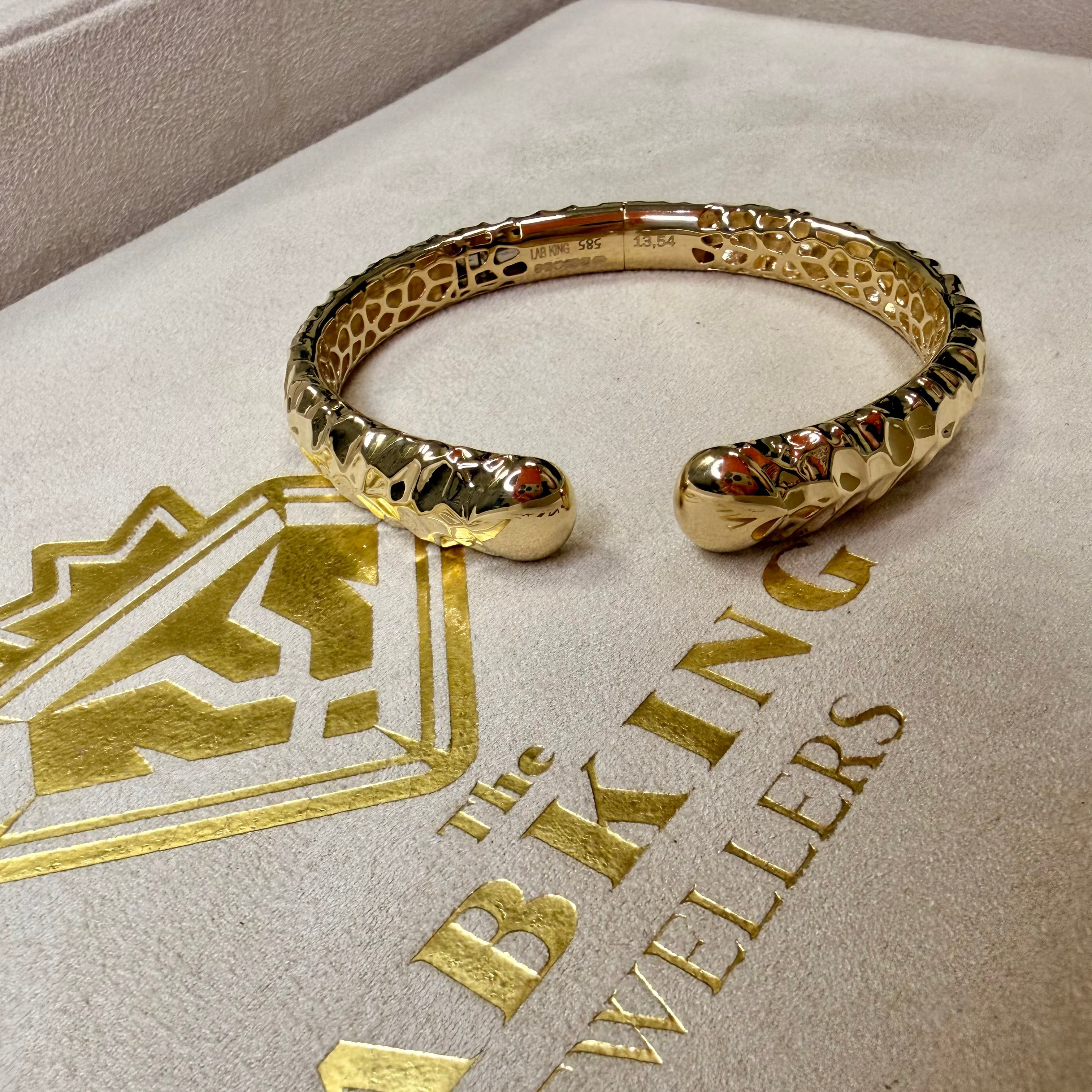 Gold bracelet on a branded jewelry box with 'Lab King Jewellers' logo.