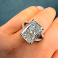 Diamond ring on a hand with a dark background