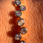 Gold bracelet with diamonds on a person's wrist