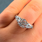 Diamond ring on a finger with a neutral background